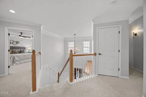a view of a dining room with furniture large windows and wooden floor