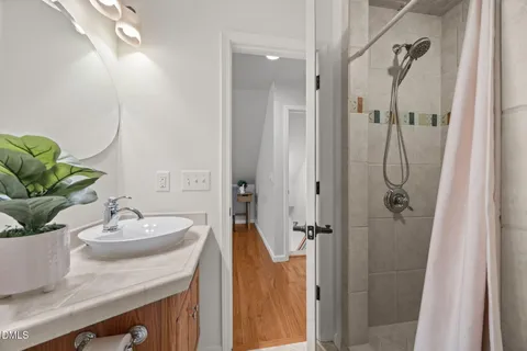 a view of balcony with wooden floor and fence