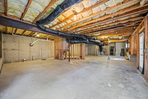a view of a deck with chairs and wooden floor