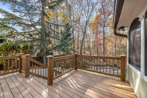 a view of a house with backyard and deck