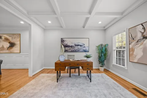 a view of staircase with wooden floor and a rug