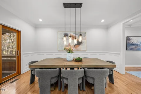a dining room with furniture and window