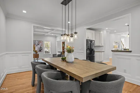 a view of a dining room with furniture and wooden floor