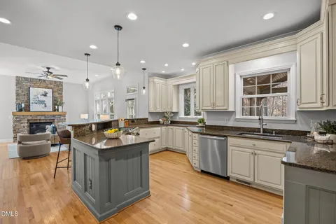 a kitchen with a table and chairs in it