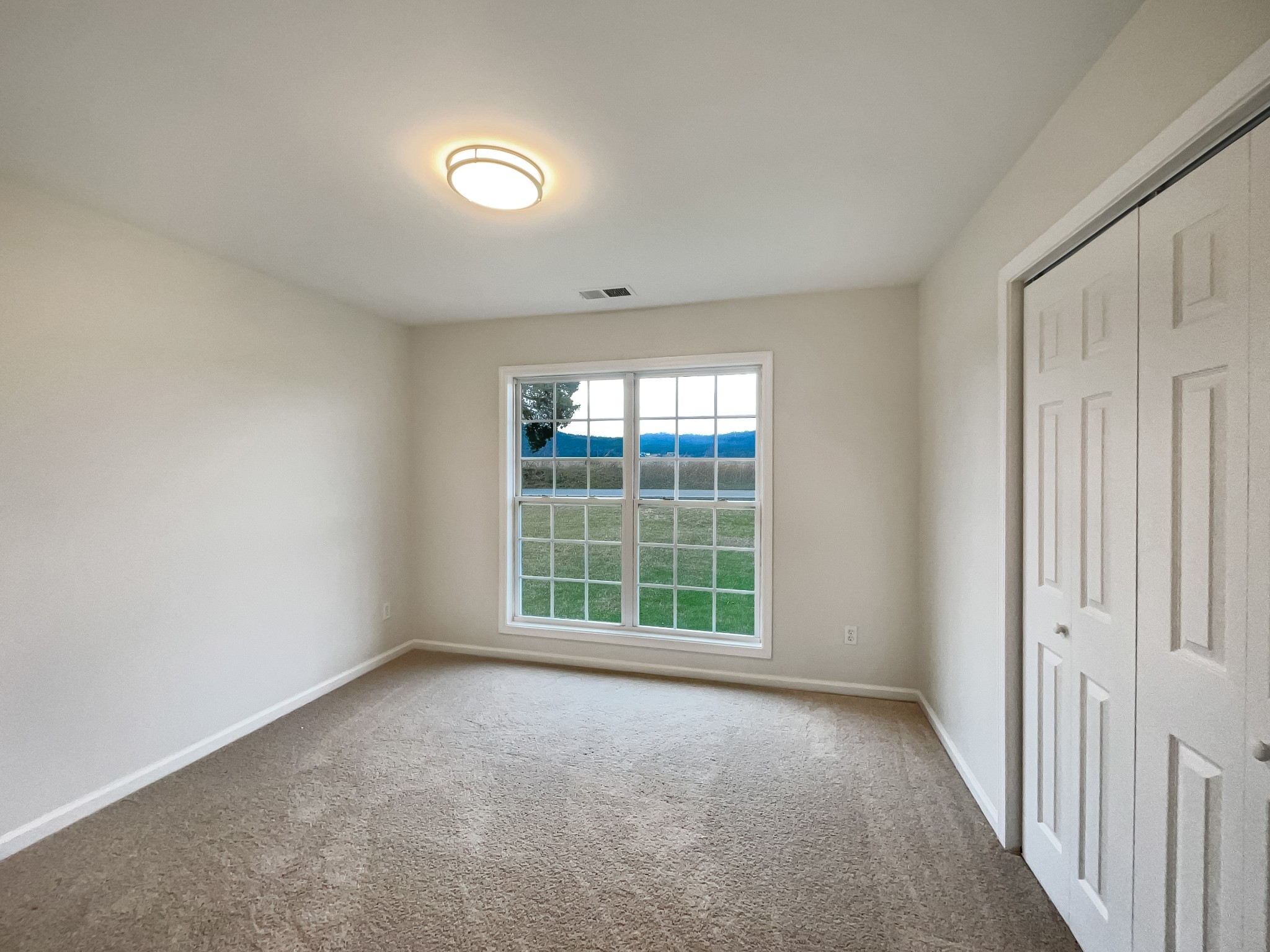 6180 Hoover Road Lascassas, TN 37085 - Photo 13 of 22 an empty room with windows