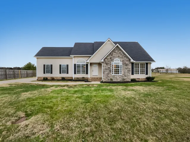 a view of a house with a big yard