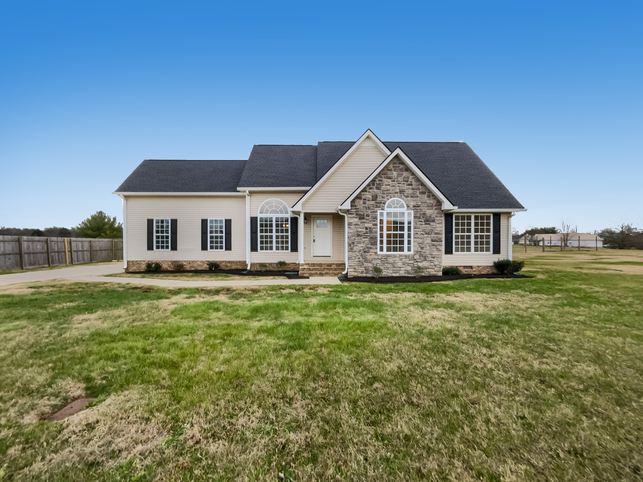 6180 Hoover Road Lascassas, TN 37085 - Photo 2 of 22 a view of a house with a big yard