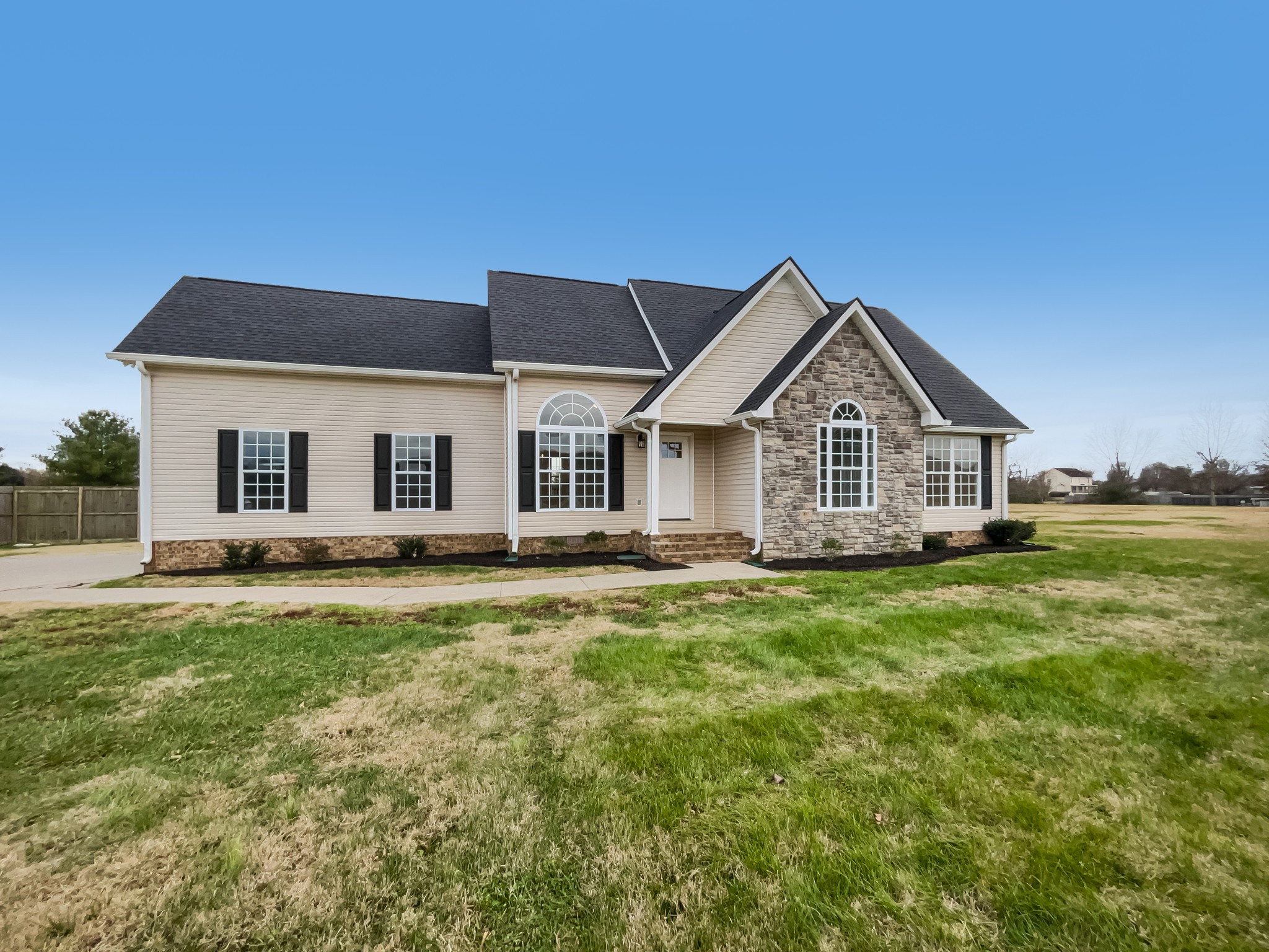 6180 Hoover Road Lascassas, TN 37085 - Photo 3 of 22 a front view of a house with a yard