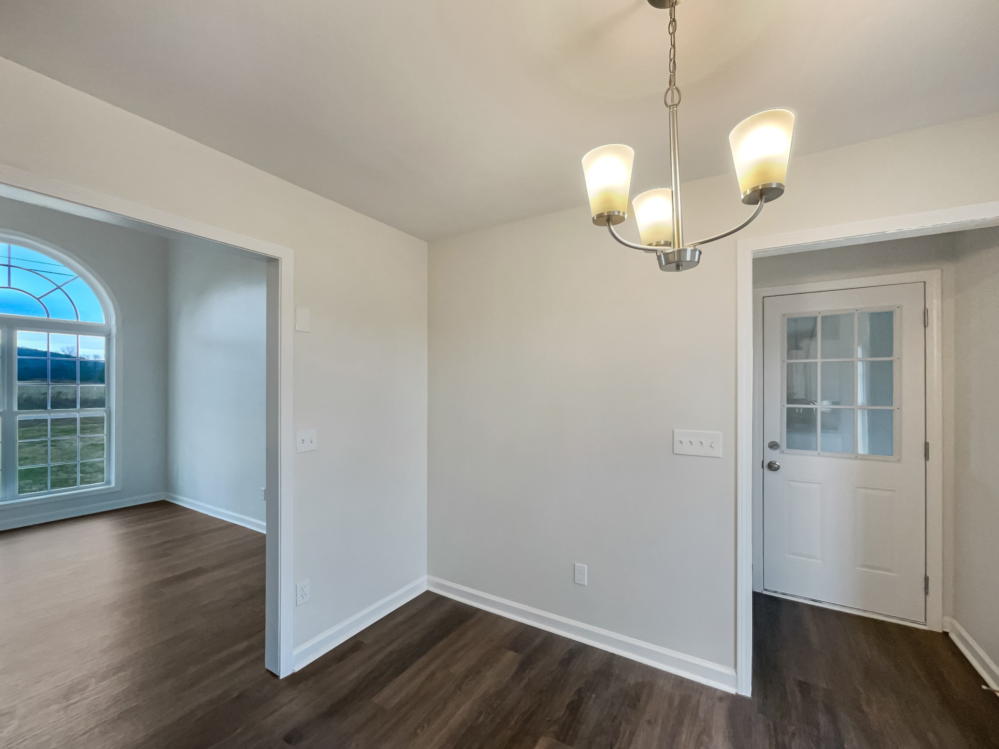 6180 Hoover Road Lascassas, TN 37085 - Photo 8 of 22 a view of a room with wooden floor and chandelier