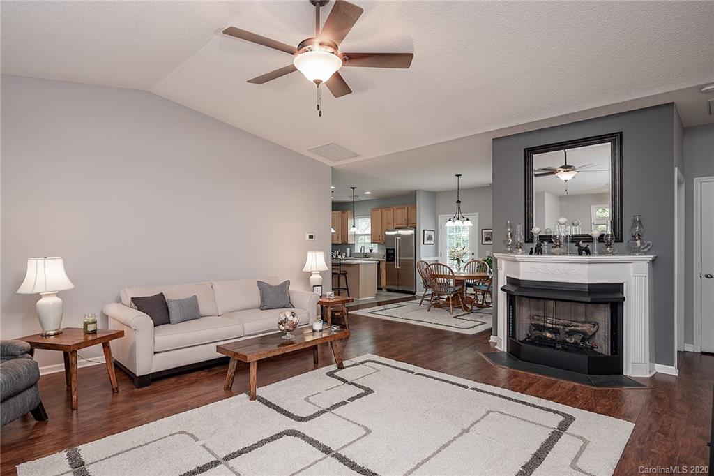16616 Timber Crossing Road Charlotte, NC 28213 - Photo 11 of 40 a living room with furniture and a fireplace