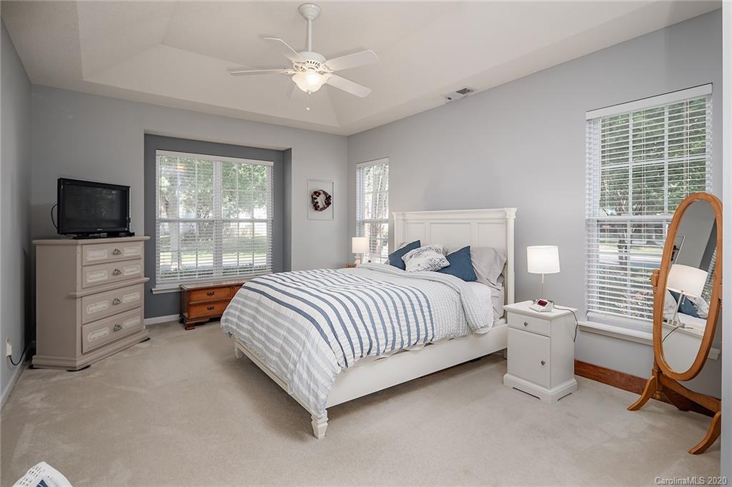 16616 Timber Crossing Road Charlotte, NC 28213 - Photo 27 of 40 a bed room with a bed and a television