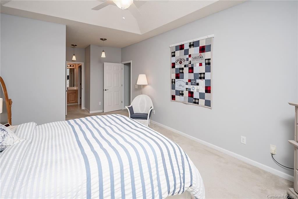 16616 Timber Crossing Road Charlotte, NC 28213 - Photo 29 of 40 a bedroom with a large bed and a window