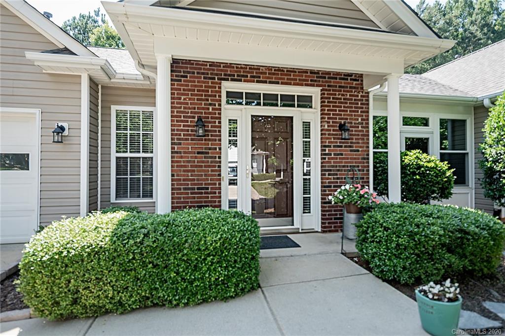 16616 Timber Crossing Road Charlotte, NC 28213 - Photo 4 of 40 a front view of a house with potted plants