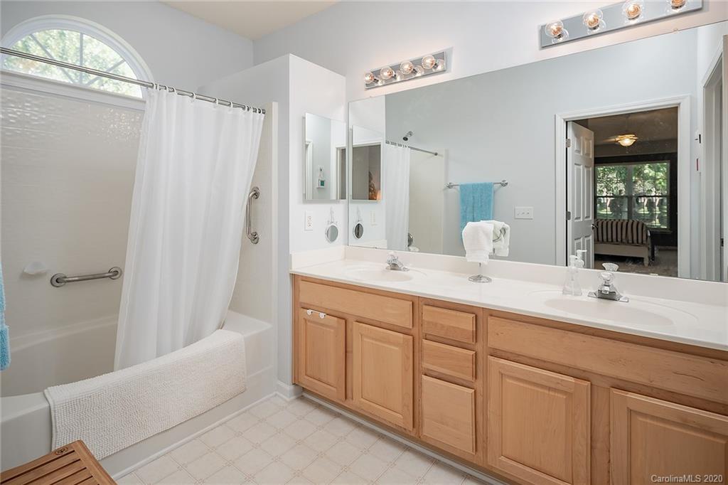 16616 Timber Crossing Road Charlotte, NC 28213 - Photo 31 of 40 a bathroom with a double vanity sink mirror and bathtub