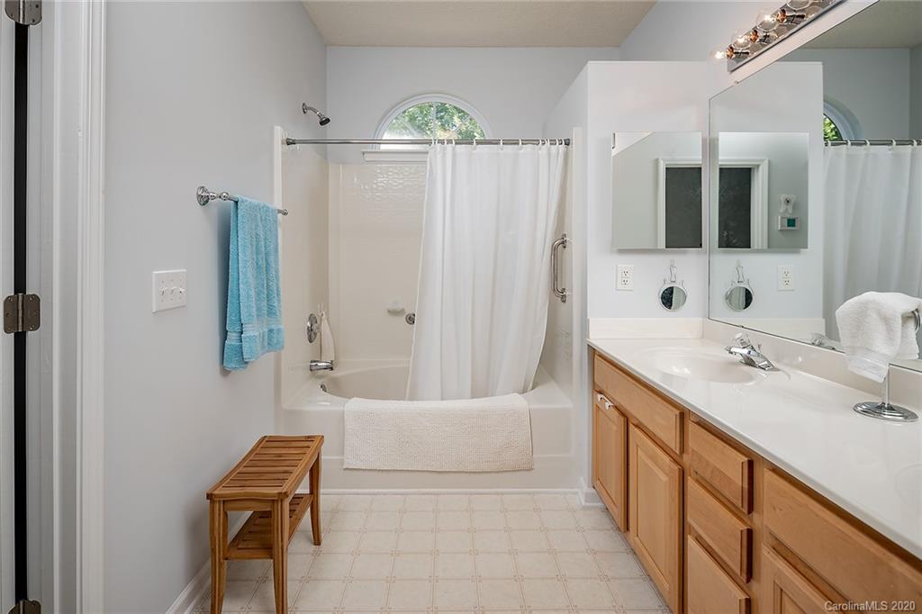16616 Timber Crossing Road Charlotte, NC 28213 - Photo 32 of 40 a bathroom with a sink a toilet and tub