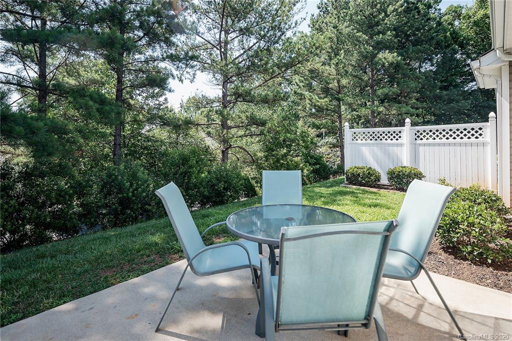 16616 Timber Crossing Road Charlotte, NC 28213 - Photo 36 of 40 a view of backyard of house with seating space and trees
