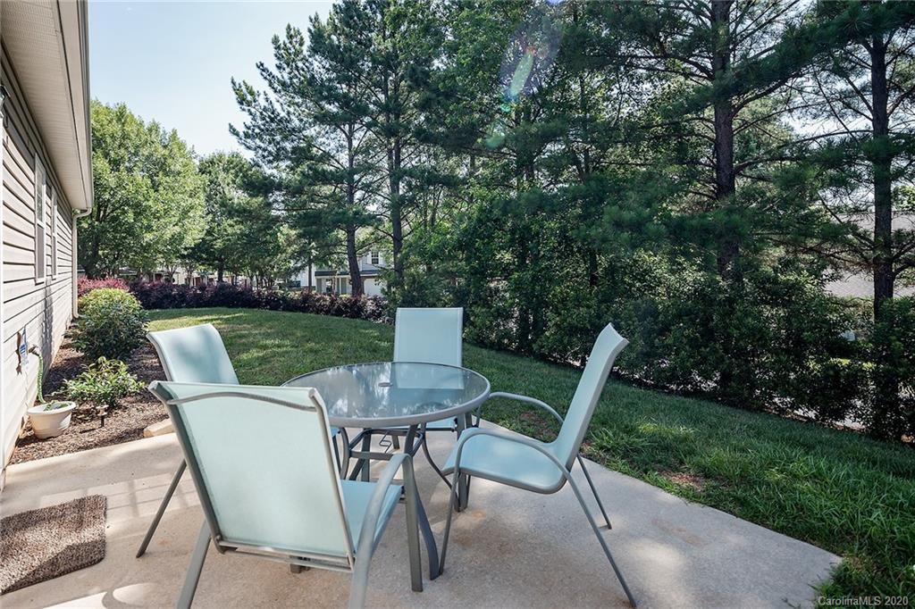 16616 Timber Crossing Road Charlotte, NC 28213 - Photo 37 of 40 a view of a chairs and table in backyard of the house