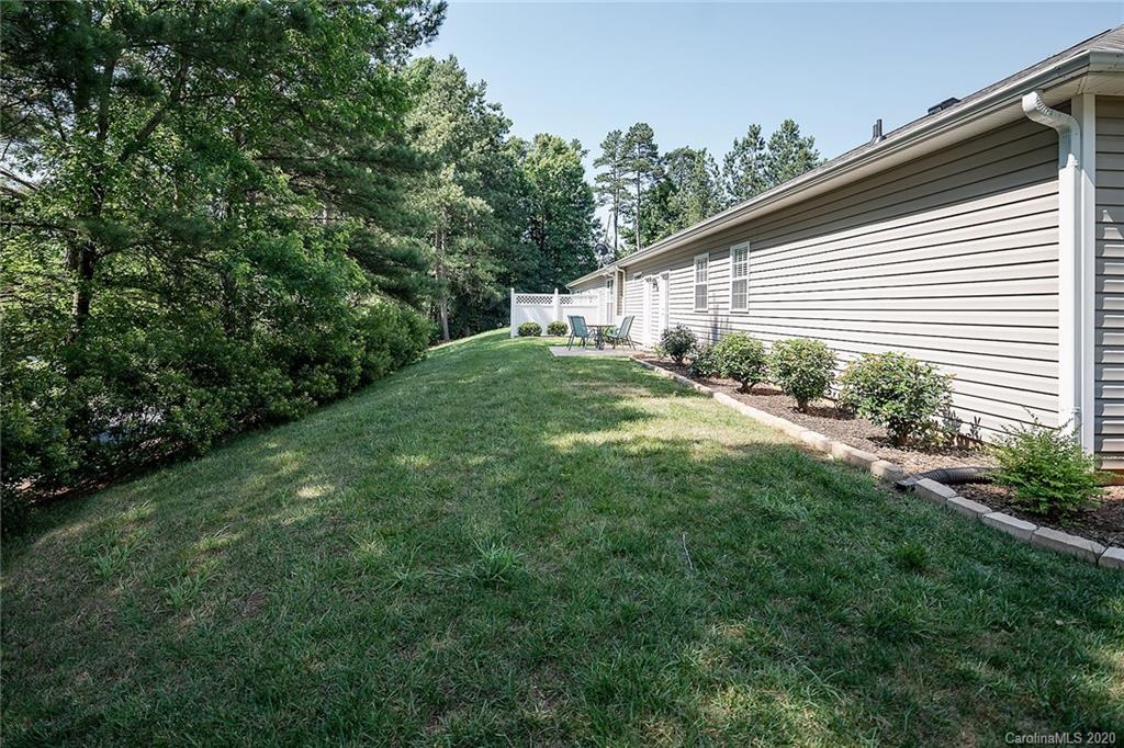 16616 Timber Crossing Road Charlotte, NC 28213 - Photo 39 of 40 a view of a backyard with plants and large trees