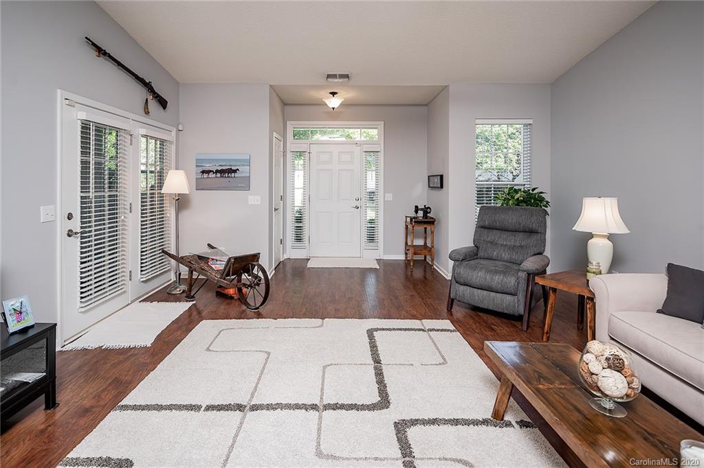 16616 Timber Crossing Road Charlotte, NC 28213 - Photo 9 of 40 a living room with furniture rug and window