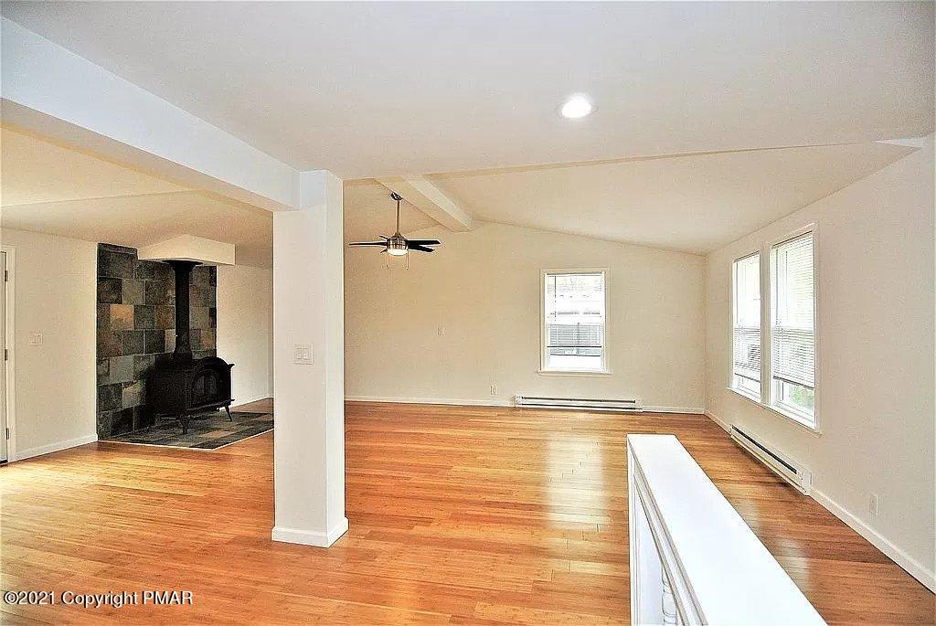 143 Britt Court Cresco, PA 18326 - Photo 11 of 35 a view of a room with wooden floor and a rug