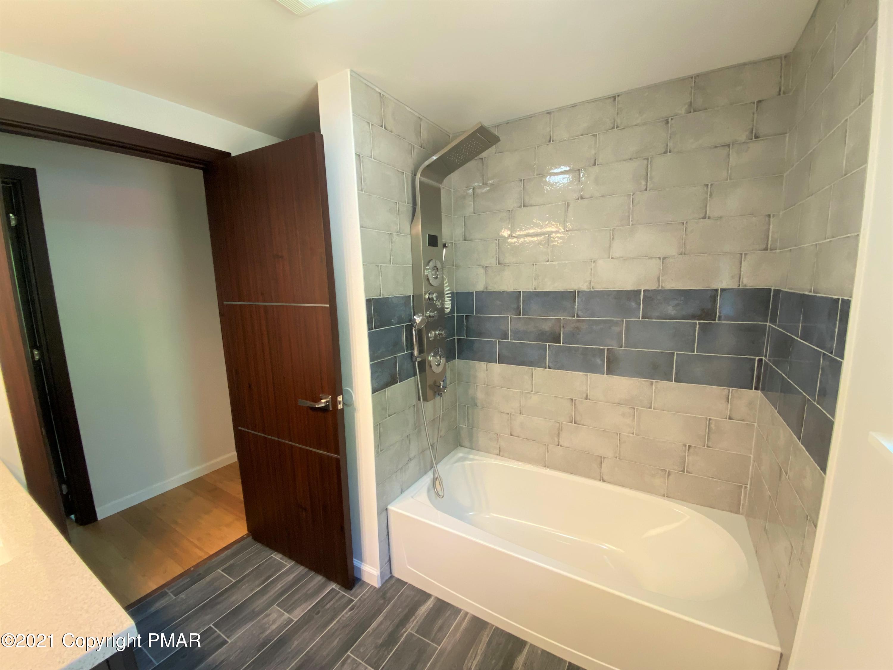 143 Britt Court Cresco, PA 18326 - Photo 15 of 35 a bath tub sitting next to a bathroom sink