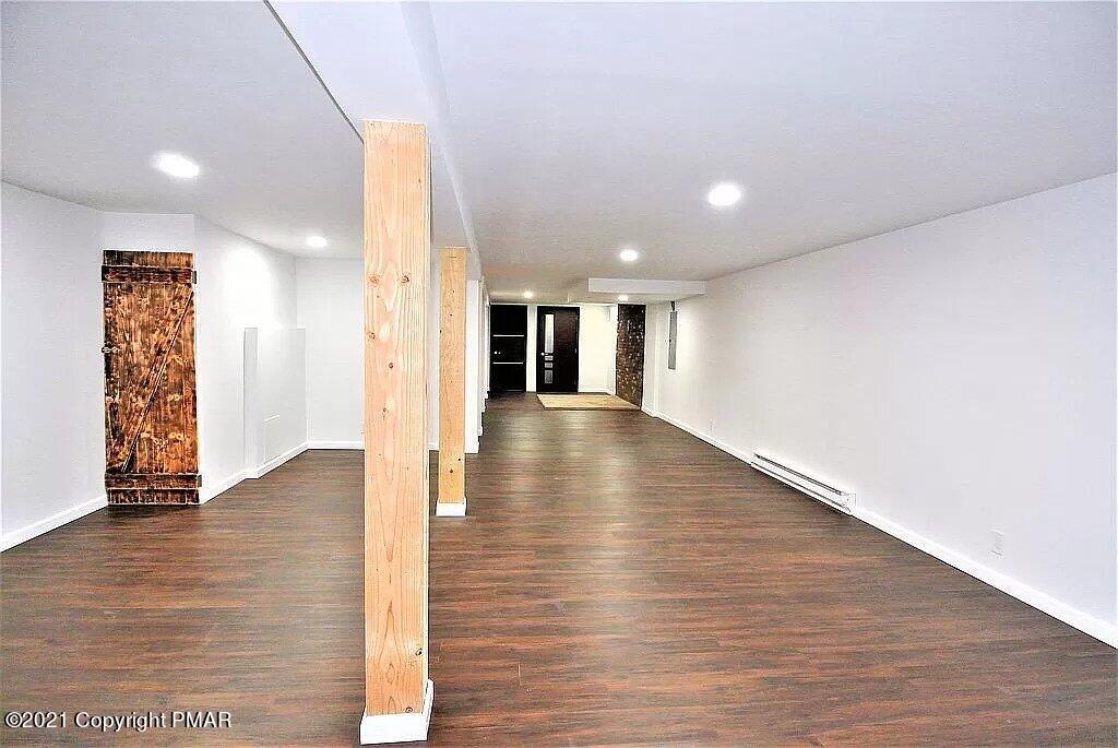 143 Britt Court Cresco, PA 18326 - Photo 24 of 35 a view of a hallway with wooden floor