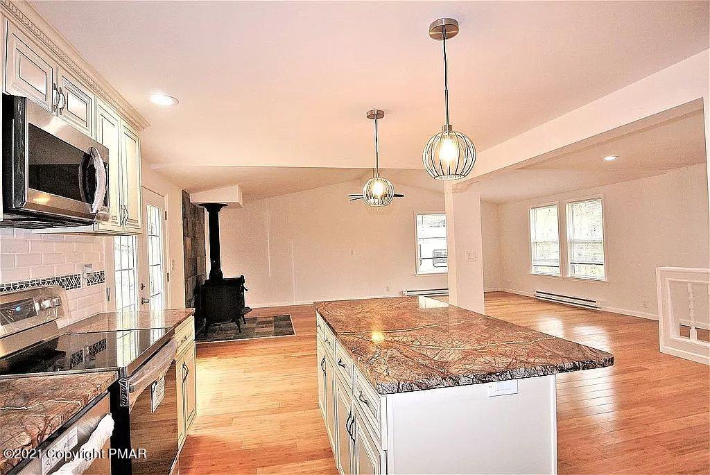 143 Britt Court Cresco, PA 18326 - Photo 3 of 35 a kitchen with stainless steel appliances granite countertop a sink stove and refrigerator