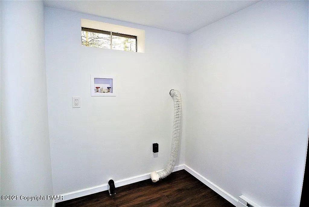 143 Britt Court Cresco, PA 18326 - Photo 32 of 35 a room with a wooden floor and window