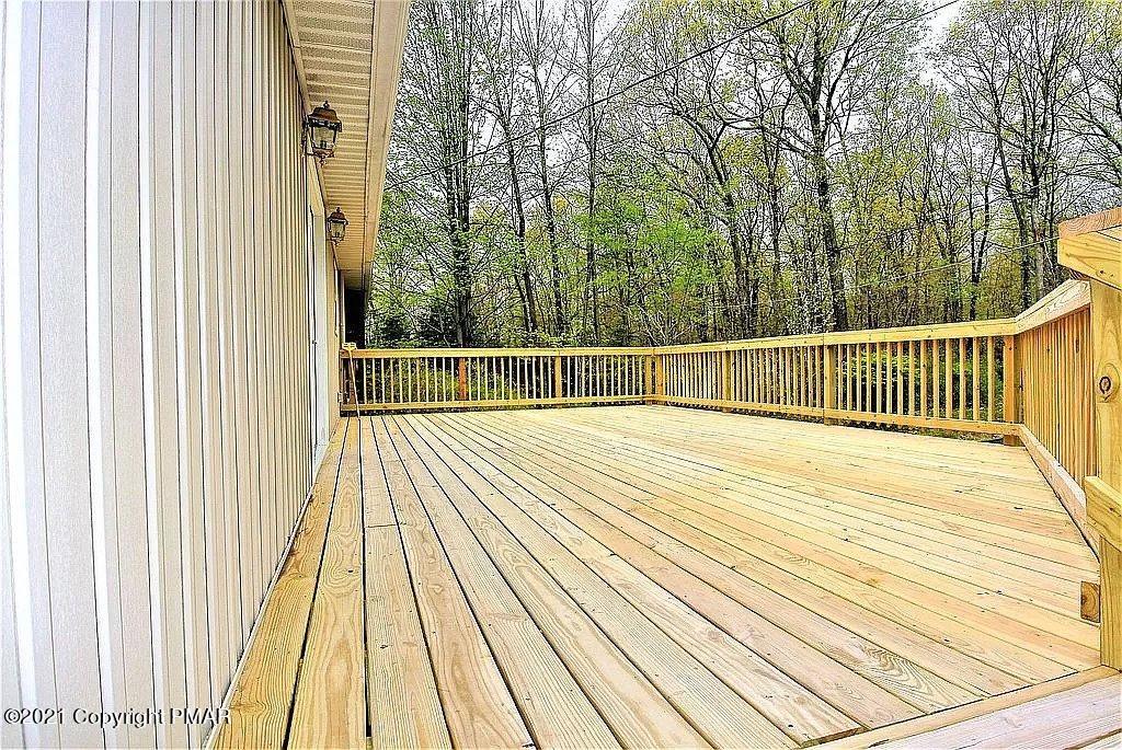 143 Britt Court Cresco, PA 18326 - Photo 34 of 35 a view of balcony with wooden floor and fence