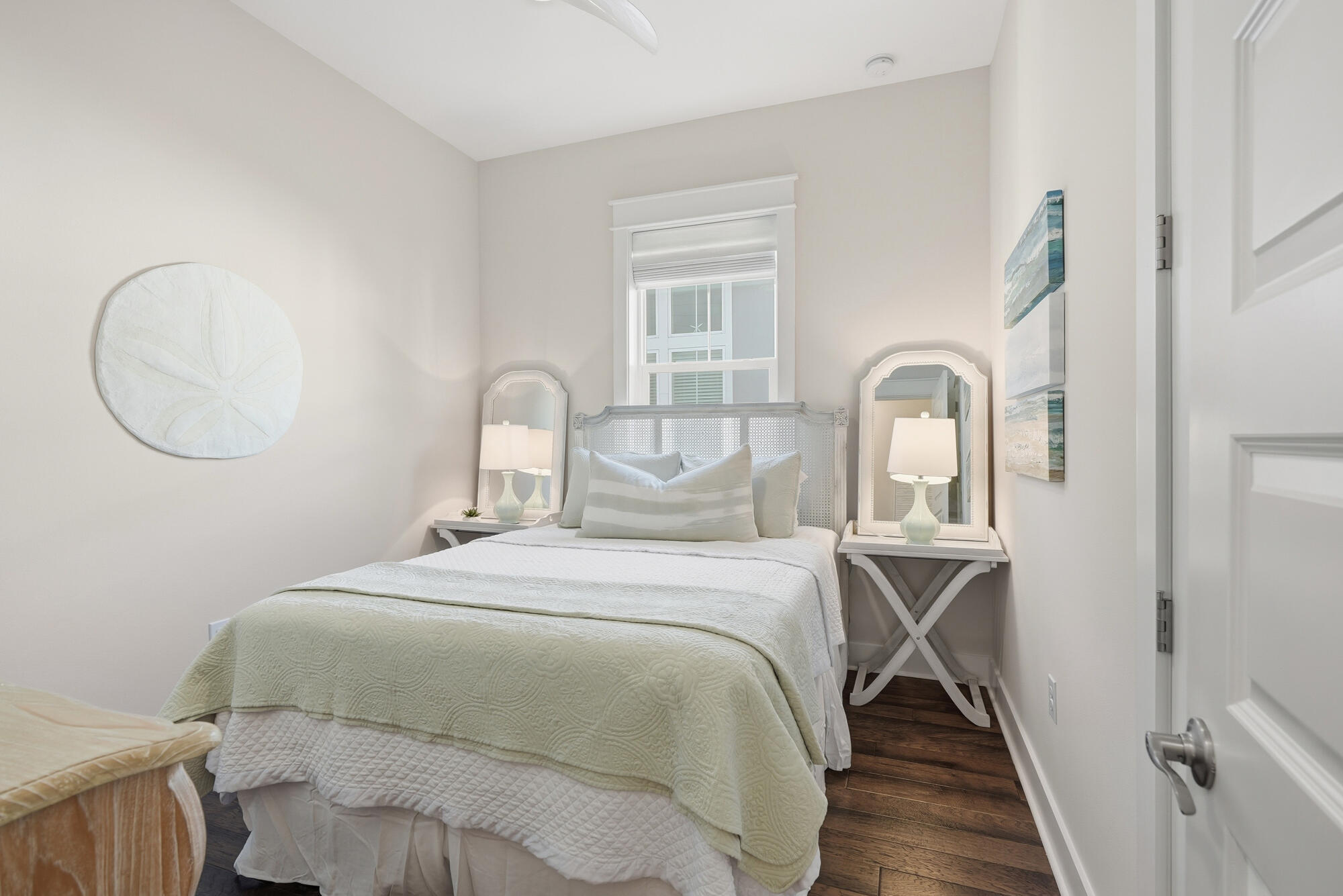 23 East York Ln Inlet Beach, Unit A Inlet Beach, FL 32461 - Photo 19 of 51 a bedroom with a bed and a mirror