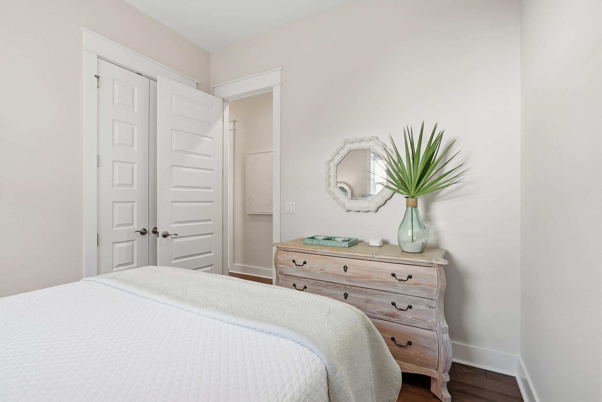 23 East York Ln Inlet Beach, Unit A Inlet Beach, FL 32461 - Photo 20 of 51 a bedroom with a bed and a potted plant