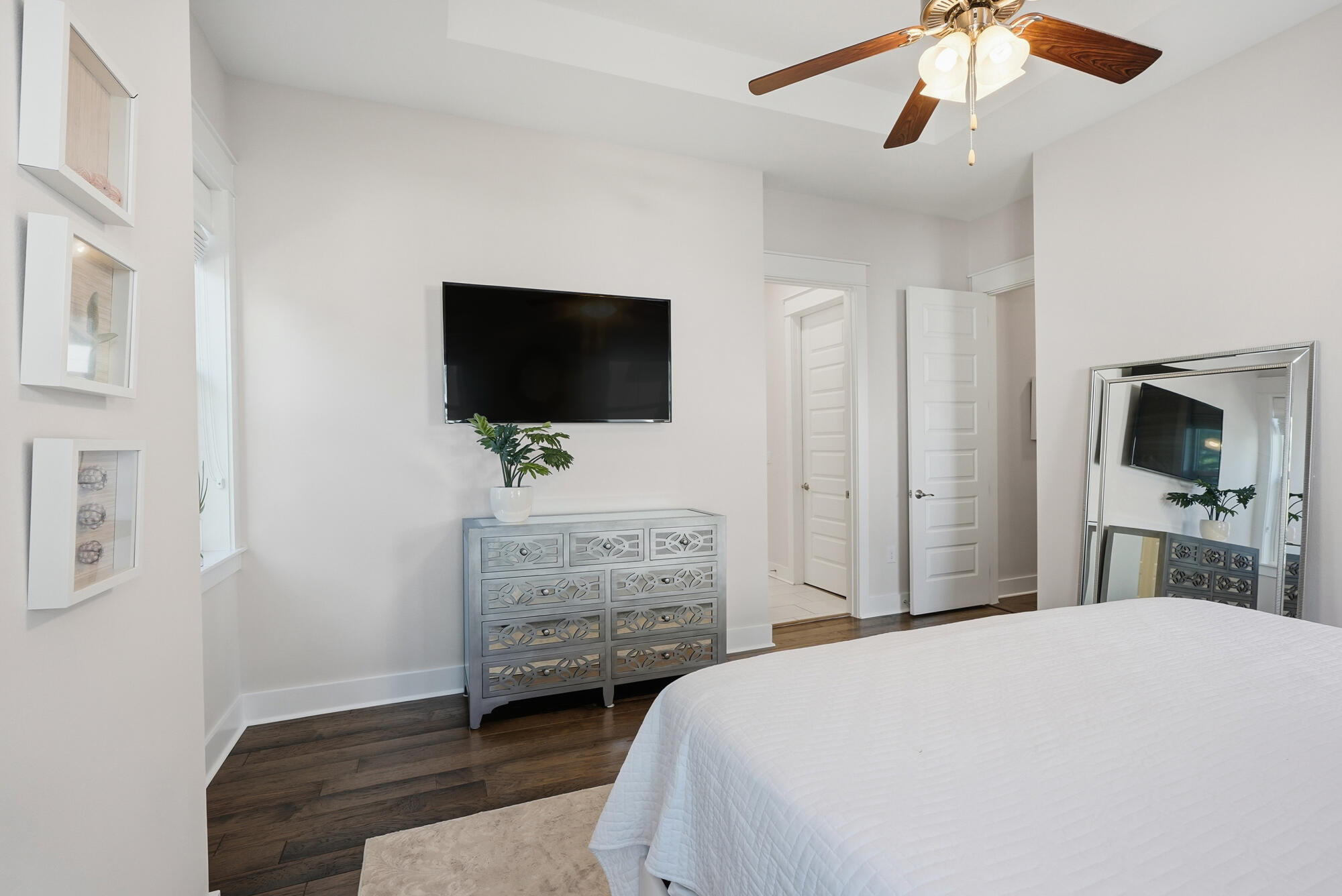 23 East York Ln Inlet Beach, Unit A Inlet Beach, FL 32461 - Photo 25 of 51 a bedroom with a bed and a flat screen tv