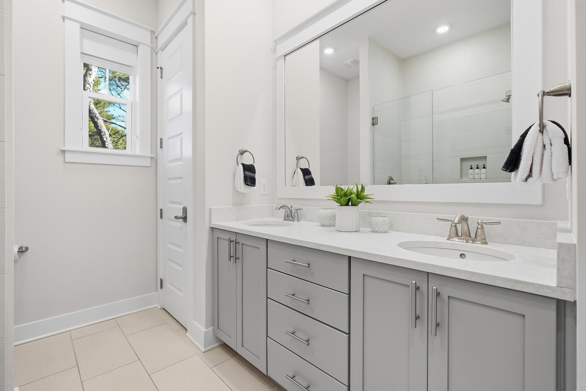 23 East York Ln Inlet Beach, Unit A Inlet Beach, FL 32461 - Photo 26 of 51 a bathroom with a double vanity sink and a mirror