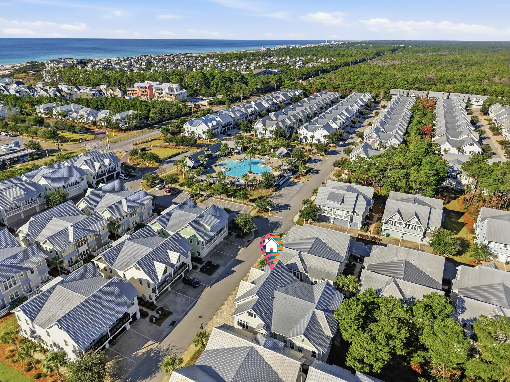 23 East York Ln Inlet Beach, Unit A Inlet Beach, FL 32461 - Photo 32 of 51 an aerial view of a city with lots of residential buildings and mountain view in back