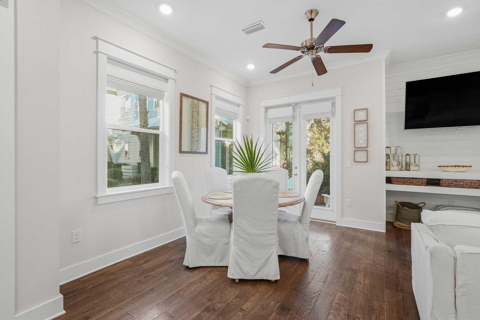 23 East York Ln Inlet Beach, Unit A Inlet Beach, FL 32461 - Photo 6 of 51 a living room with furniture wooden floor and a flat screen tv