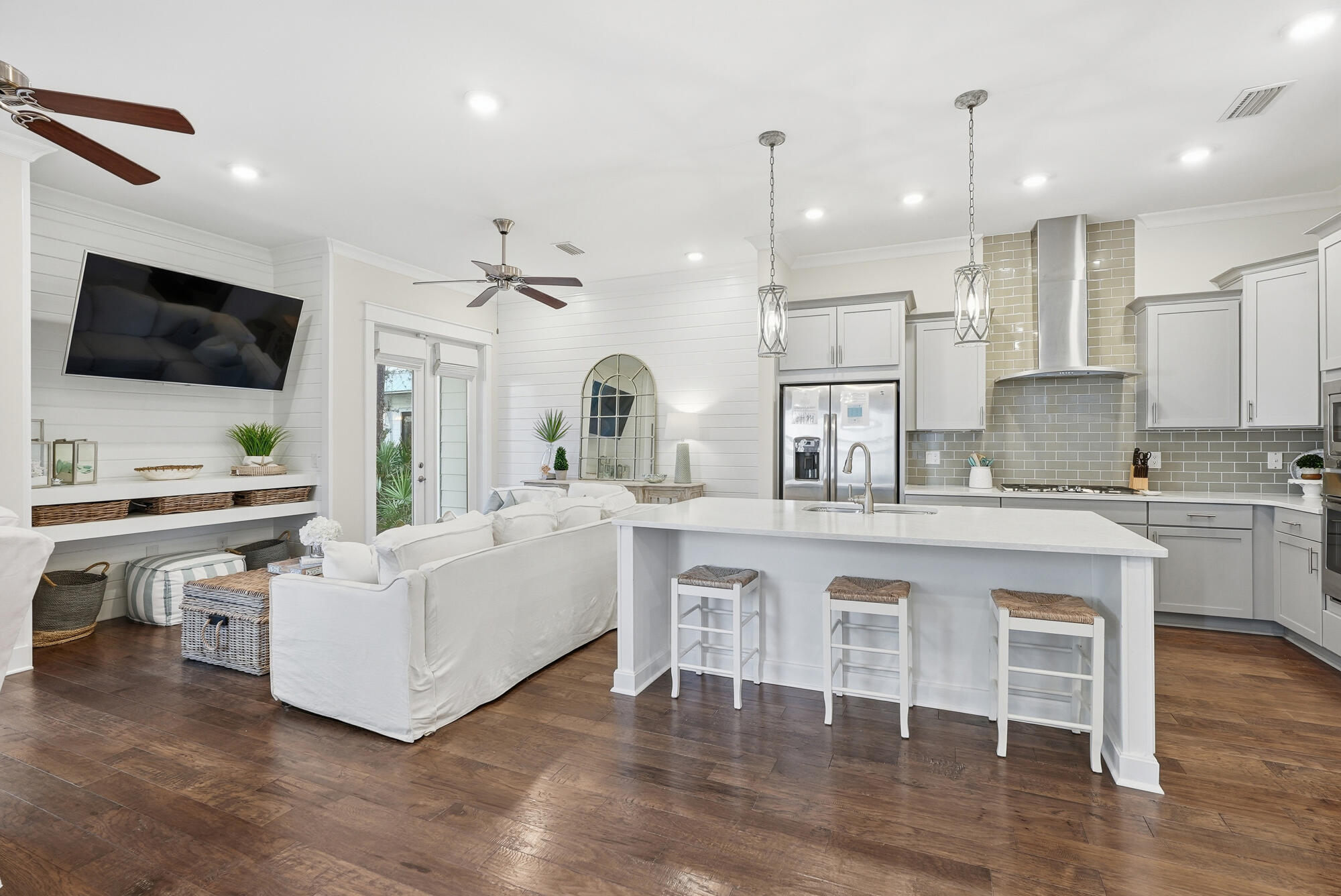23 East York Ln Inlet Beach, Unit A Inlet Beach, FL 32461 - Photo 10 of 51 a large white kitchen with a sink and living room view