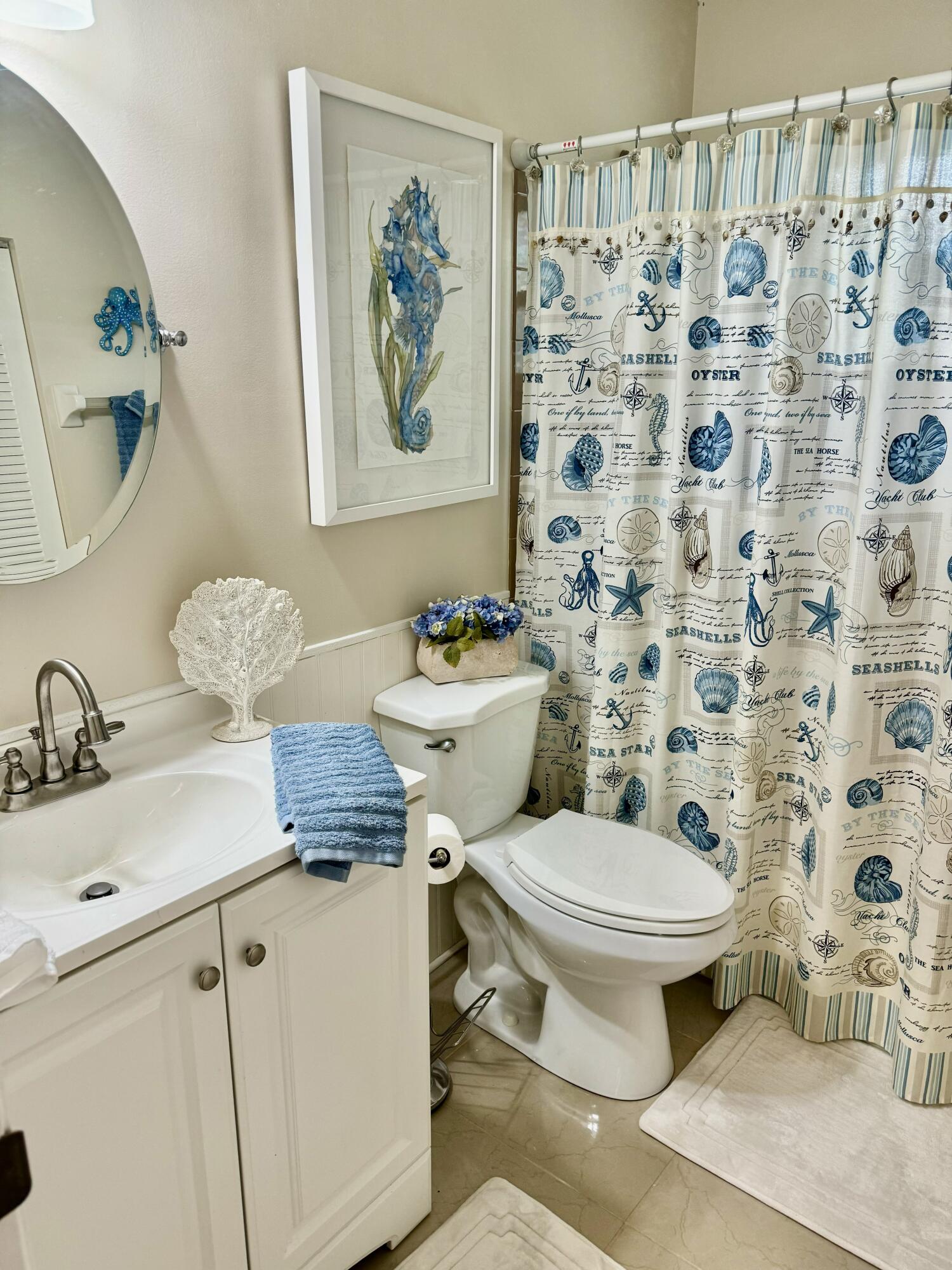 5248 Southeast 43rd Trace Okeechobee, FL 34974 - Photo 11 of 35 a bathroom with a sink toilet and a mirror