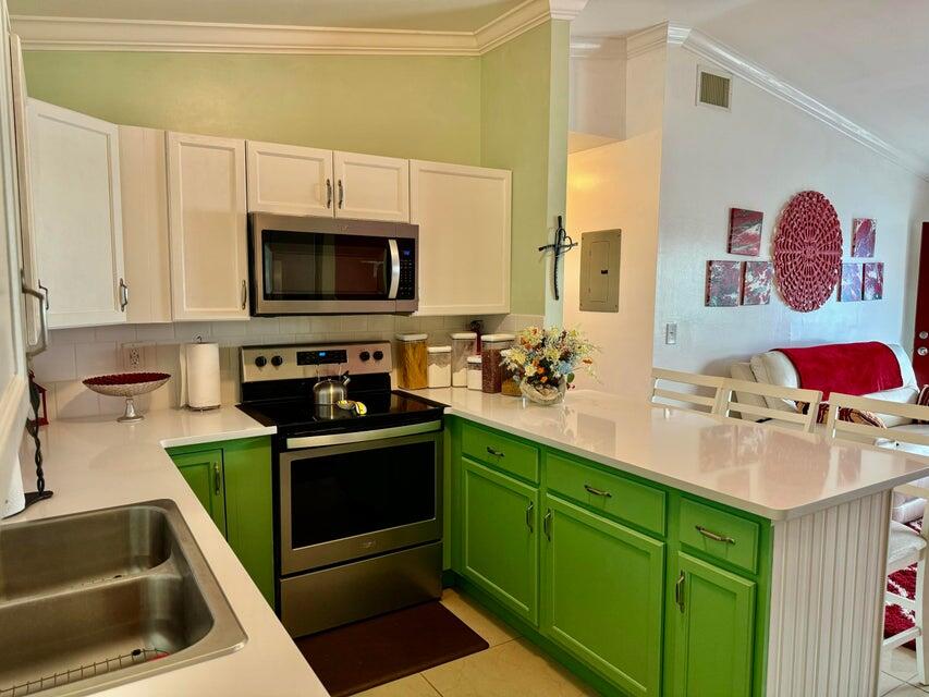 5248 Southeast 43rd Trace Okeechobee, FL 34974 - Photo 15 of 35 a kitchen with a sink and a stove top oven