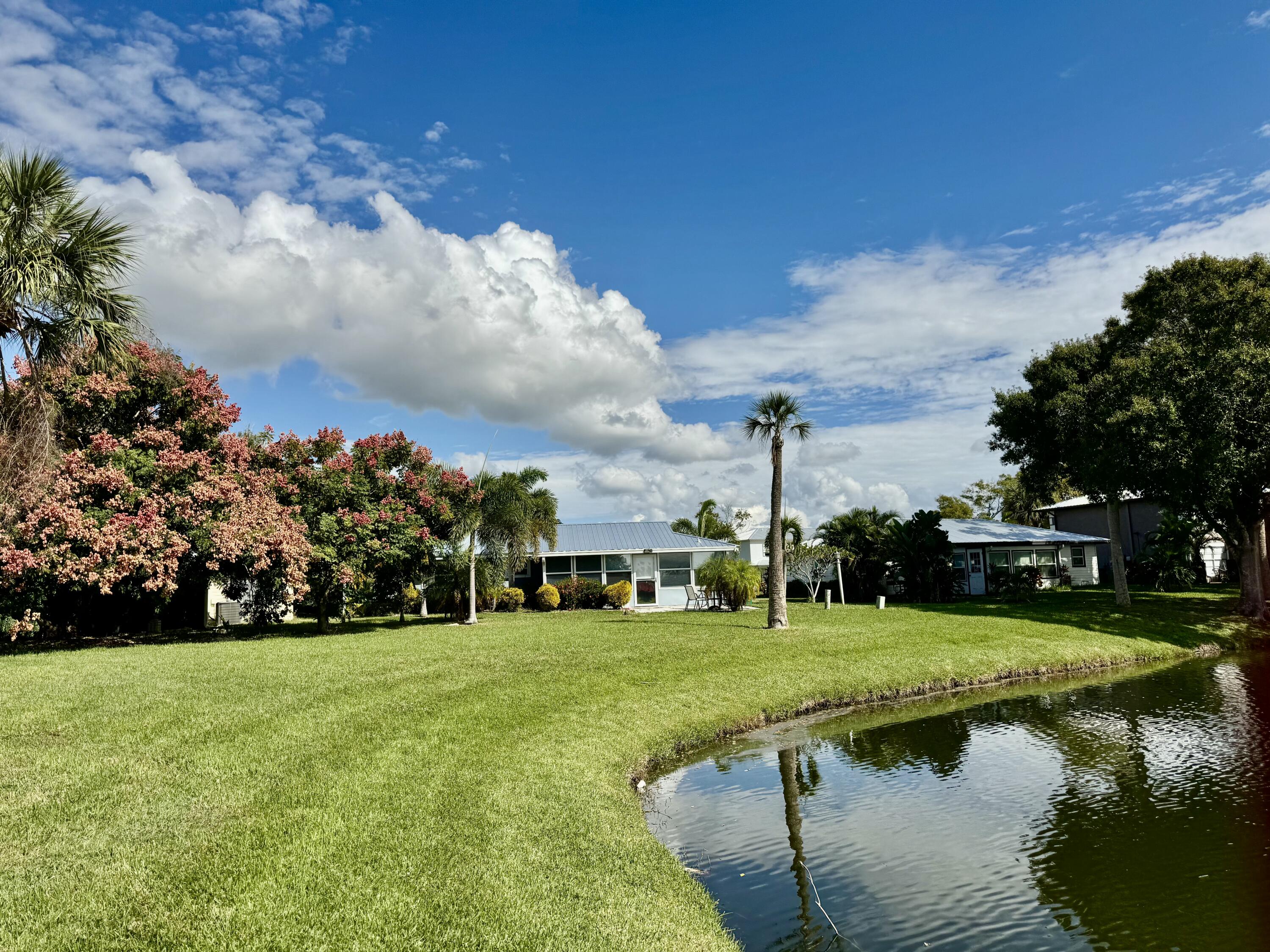 5248 Southeast 43rd Trace Okeechobee, FL 34974 - Photo 3 of 35 a view of yard with swimming pool and green space
