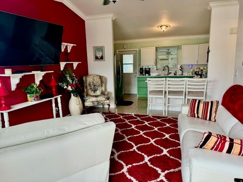 5248 Southeast 43rd Trace Okeechobee, FL 34974 - Photo 5 of 35 a living room with furniture and a flat screen tv