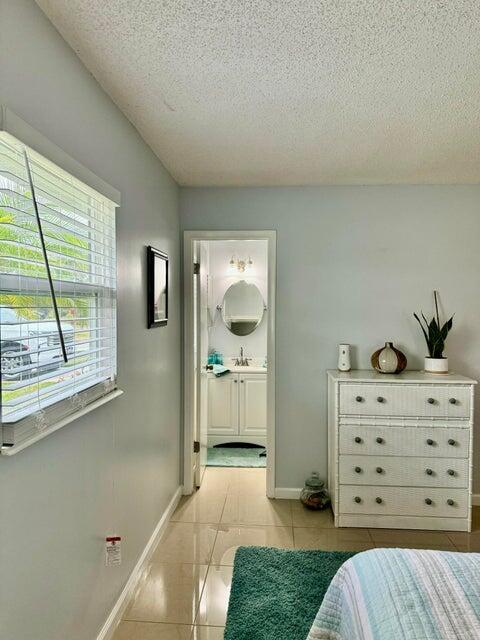 5248 Southeast 43rd Trace Okeechobee, FL 34974 - Photo 8 of 35 a view of bedroom with furniture and window