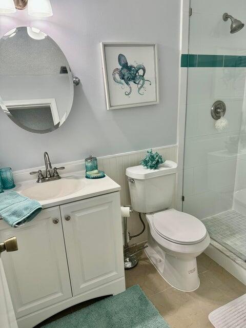 5248 Southeast 43rd Trace Okeechobee, FL 34974 - Photo 9 of 35 a bathroom with a sink toilet and a mirror