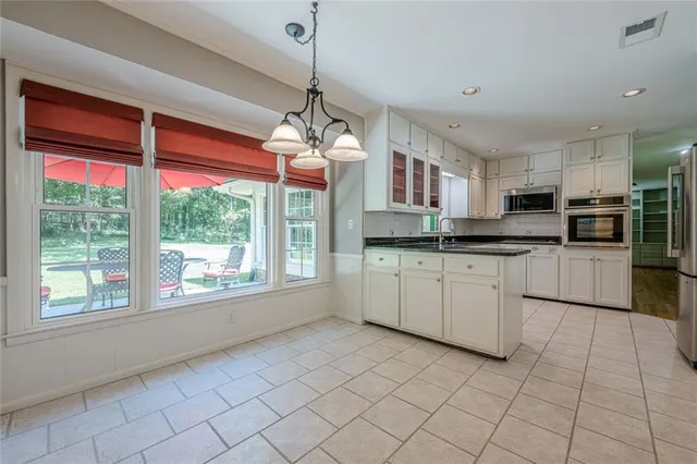 a view of a kitchen with a sink and a microwave