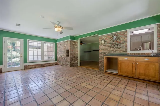 a view of a big room with closet and a chandelier fan