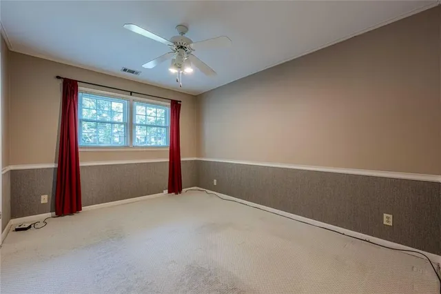 a patio with a table and chairs under an umbrella