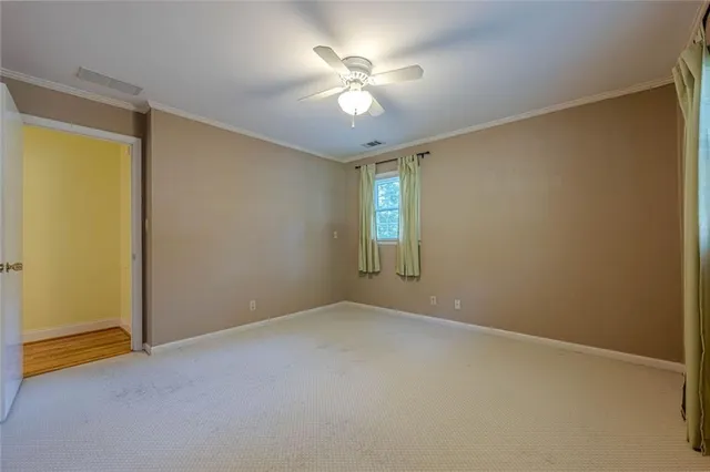 a view of a house with backyard porch and sitting area