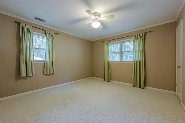 a front view of a house with a large window