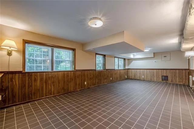 an aerial view of a house with a yard and garden