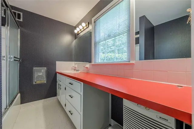 a view of a two chairs in the patio