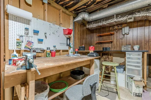 an aerial view of a house with a yard basket ball court and outdoor seating